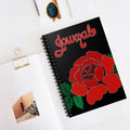 Journal with red rose design on a white surface