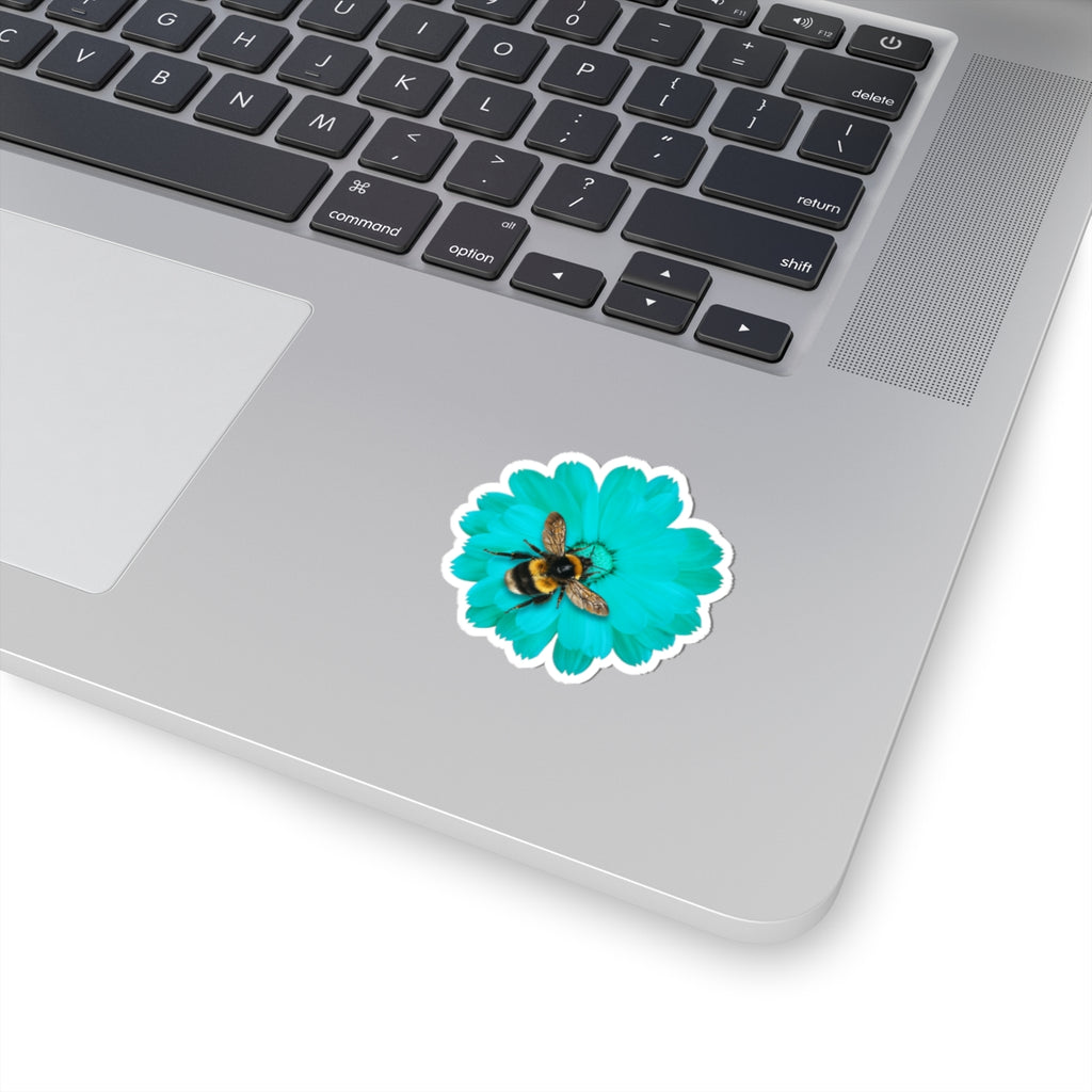 Laptop with a sticker of a bee on a blue flower
