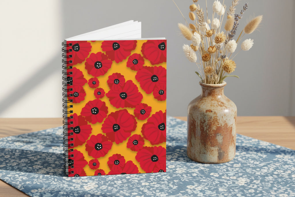 Notebook with red floral poppy flowers pattern on a yellow background