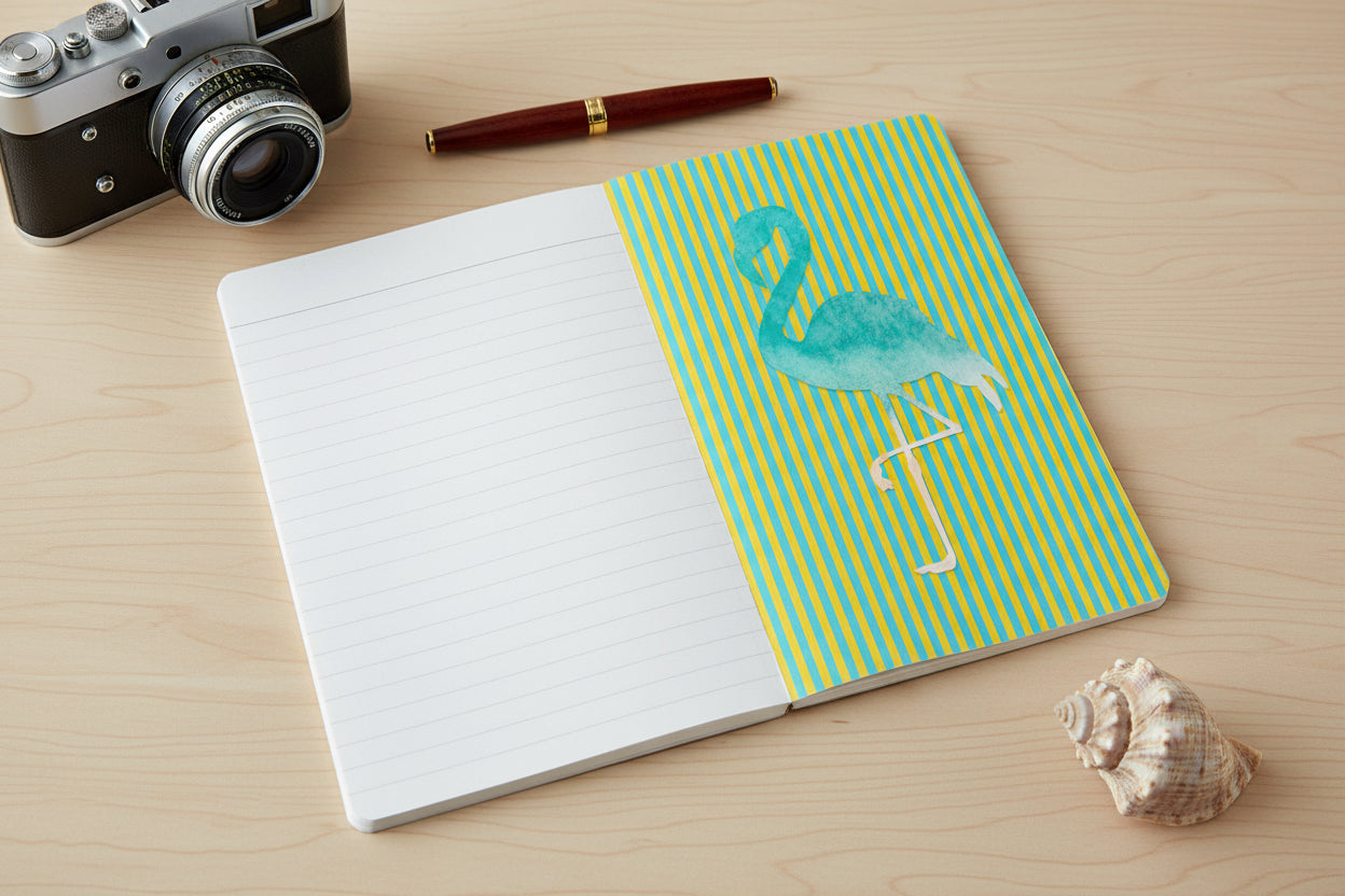 Open journal with lined page and flamingo design over vertical green stripes.