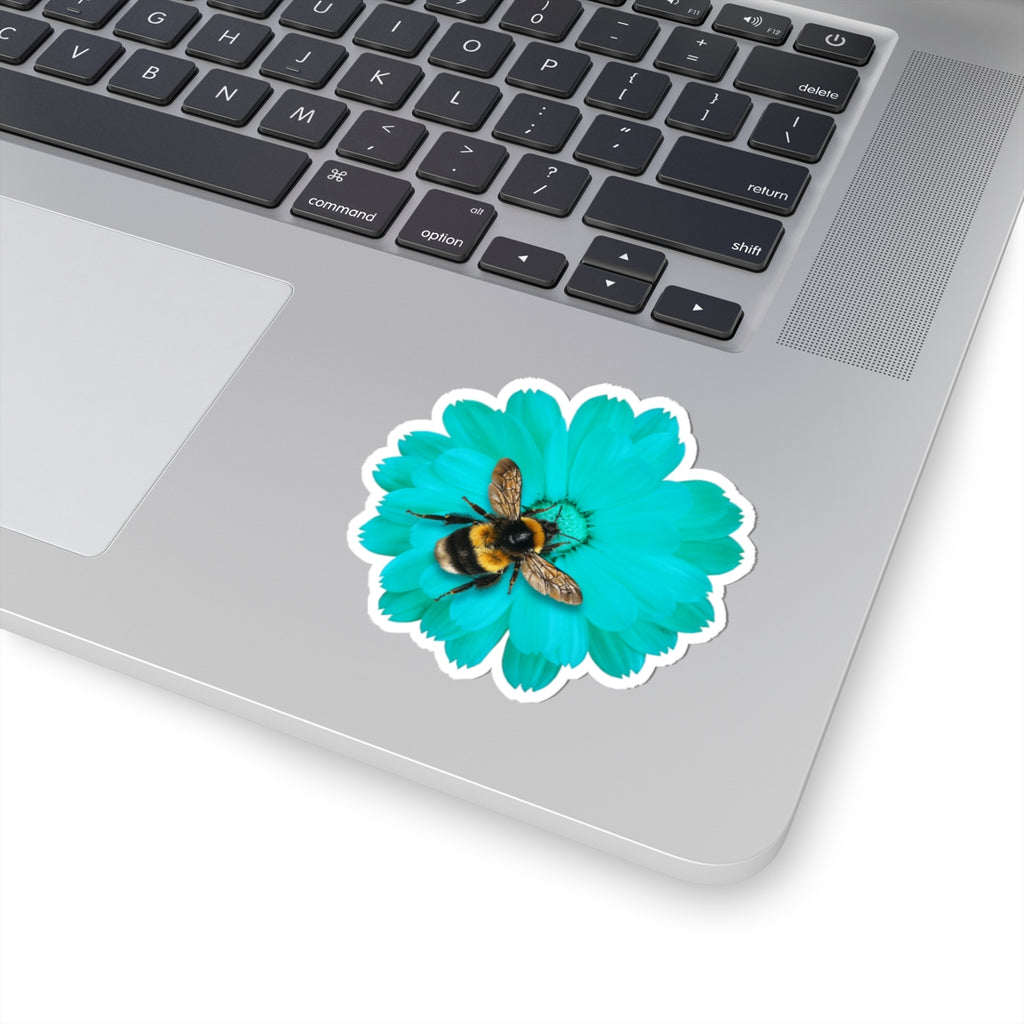 Teal flower sticker with a bee on a laptop
