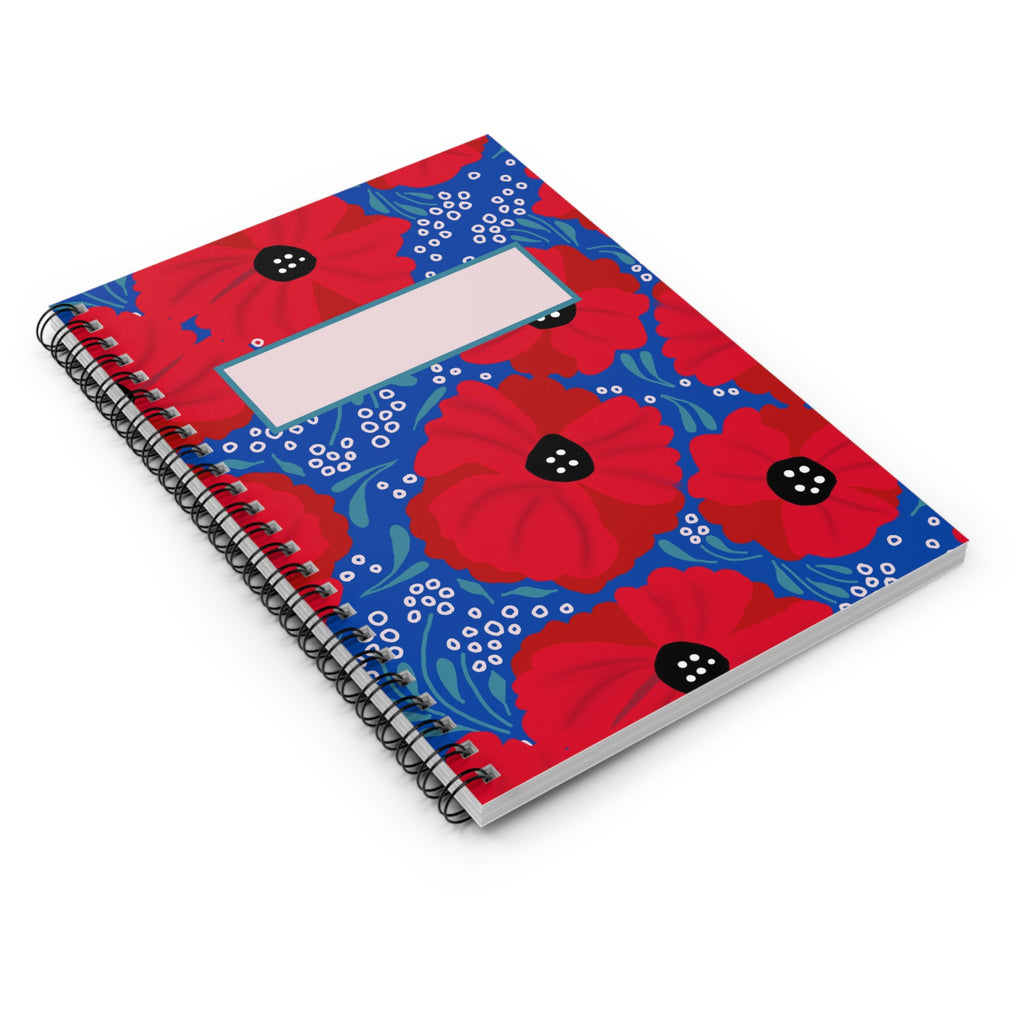 Notebook with red floral design on a white background