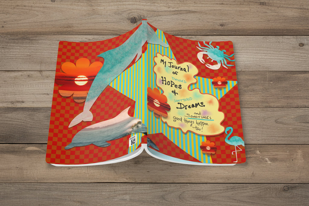 Colorful journal with dolphin illustrations on a white background